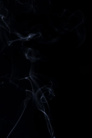 white smoke on black backgroundの写真素材