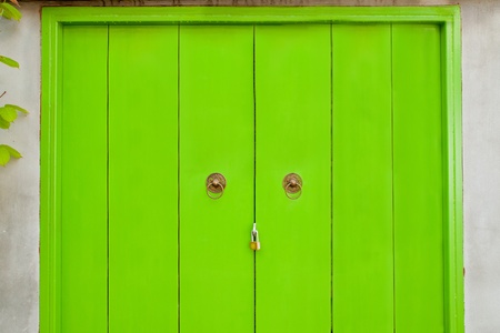 Wooden door painted green at home 