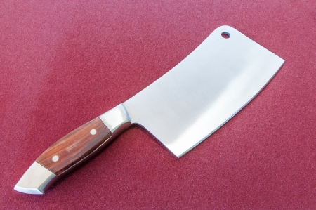 Chopper kitchen knife on a red background の写真素材