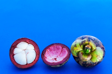 Mangosteen Fruit and meat on a blue background の写真素材