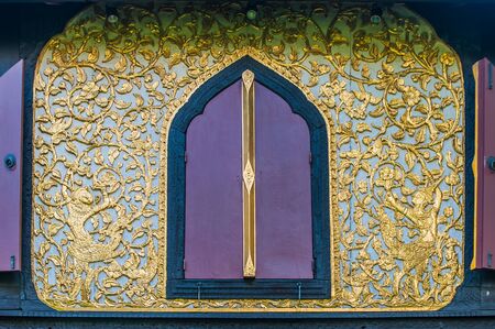 Pattern with carved windows of old houses in Thailand の写真素材