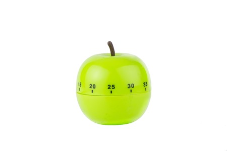 Kitchen timer in the shape of a green appleの写真素材