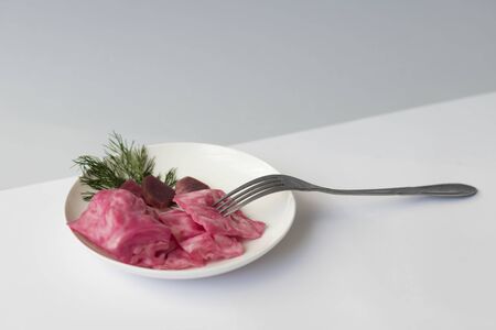 fermented cabbage, with beets on a plate