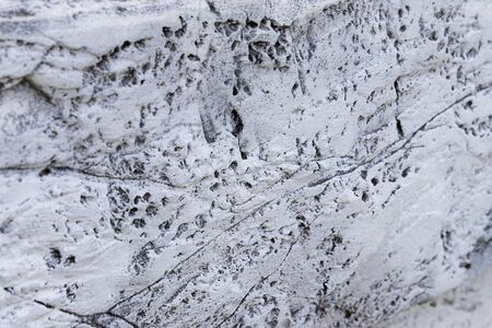Background from closeup high detailed fragment textured of white stone wall a old building