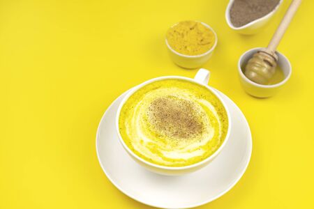 Golden milk, golden latte, turmeric milk, Detox, immune boosting, anti inflammatory healthy cozy drinkの写真素材