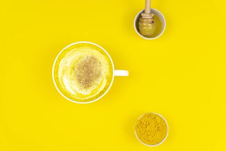 Golden milk, golden latte, turmeric milk, Detox, immune boosting, anti inflammatory healthy cozy drinkの写真素材