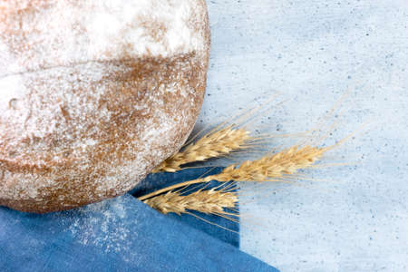 Delicious fresh rye bread on wooden background, horizontal orientation