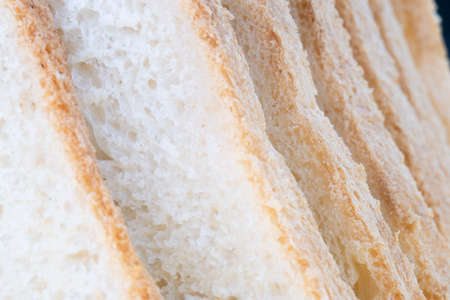 Closeup macro of loaf of bread with slicesの写真素材