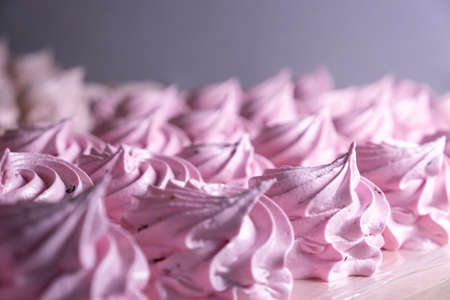 Handmade pink marshmallows on parchment background. Marshmallow, Meringue. Homemade Sweets dessertの写真素材