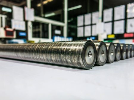 Round steel rods, hardened black, striped.
 Many bars are stocked for sale to customers.の写真素材