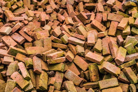 Old red brick is a raw material for construction.の写真素材