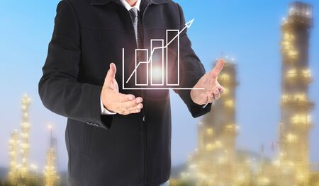 Double exposure of businessman standing area of refinery oil and gas projectの写真素材