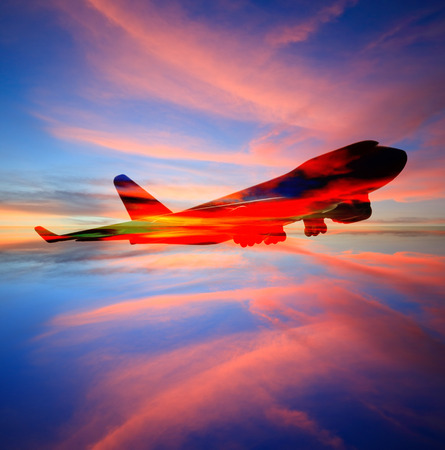 passenger plane on sky at sunset time very beautiful , use for air transport ,journey and travel industry businessの写真素材
