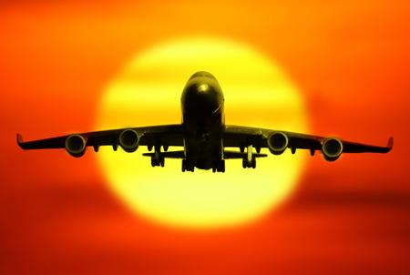 passenger plane on sky at sunset time very beautiful , use for air transport ,journey and travel industry businessの写真素材