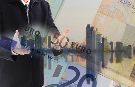 Double exposure of businessman working with new big city and EURO money  background and business strategy as conceptの写真素材