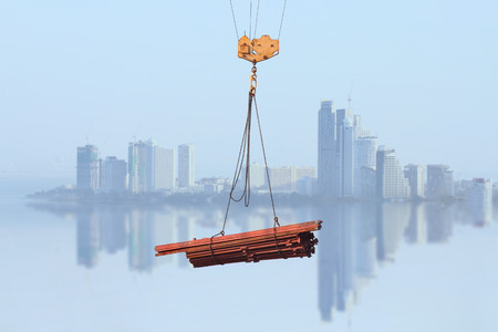 Crane Hook with Stack of Steel Metalの写真素材