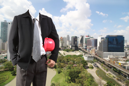 businessman hand working with new big city background and business strategy as conceptの写真素材