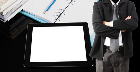 Double exposure of businessman and tablet pc on tableの写真素材