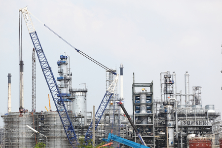 oil and gas industry in powerful and crane at work areaの写真素材