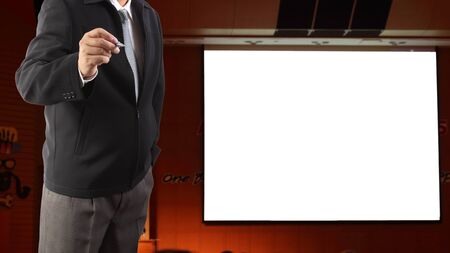 confident business man giving presentation with white boardの写真素材