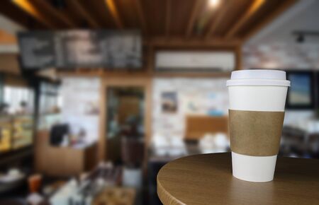 Takeout coffee in thermo cup in coffee shopの写真素材