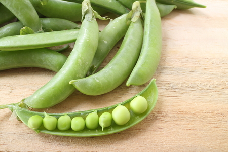 fresh beans broad over wood background, selective focusの写真素材