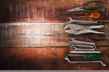 set of hand tools on a wooden panelの写真素材