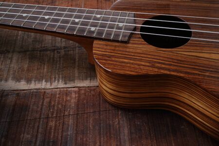 ukulele on old woodenの写真素材