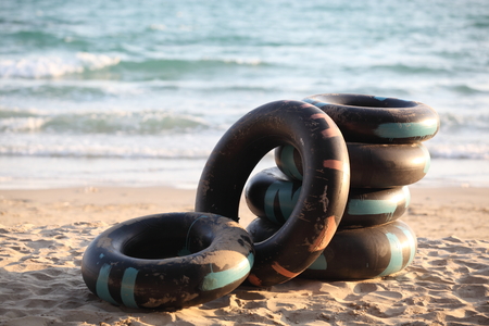 Stack of colorful swimming ringsの写真素材