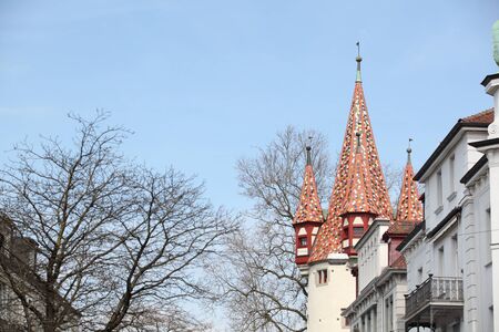 A house with large flower beds full of tulips.の写真素材