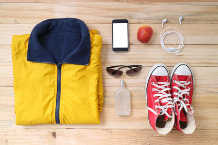 Outfit of traveler, student, teenager, young woman or guy. Overhead of essentials for modern young...