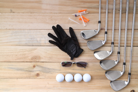 Golf equipment on wood floor preparing for good gameの写真素材