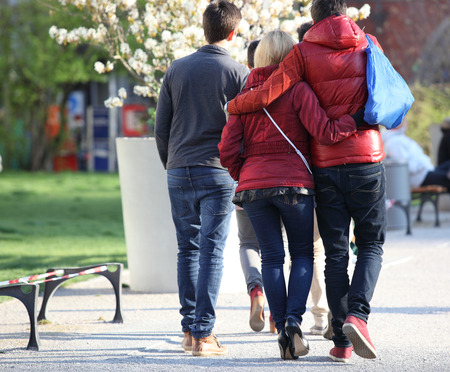 Young couple hugging on road