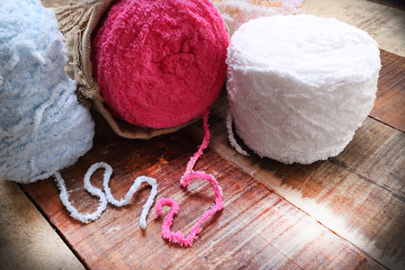 Colorful yarn balls on a wooden background room for copy space  vintage styleの写真素材