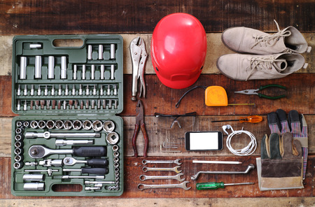 set of hand tools on a wooden tableの写真素材