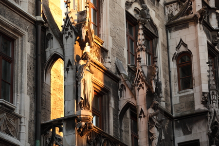 Medieval Town Hall building with spires Munich Germany. The first floor looks towards the Marienplatz- used for festivals and public events. The daily clock tower show is a tourist attraction.の写真素材