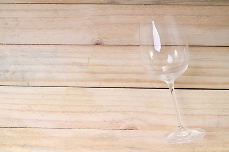 Empty glass isolated on wood tableの写真素材