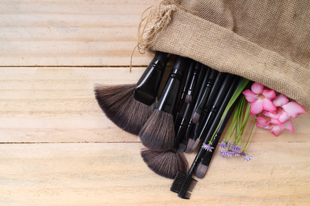 Various makeup products on dark background with copyspaceの写真素材