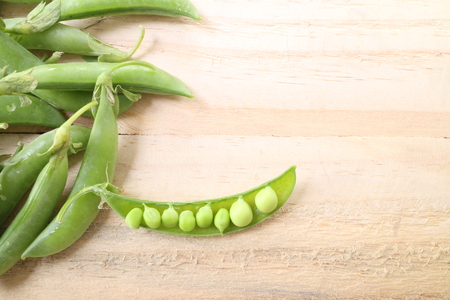 fresh beans broad over wood background, selective focusの写真素材