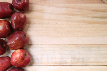 Sweet apples on wooden backgroundの写真素材