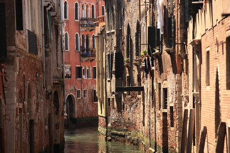 among old colorful brick houses in Venice, Italy.の写真素材