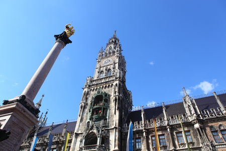 Medieval Town Hall building with spires Munich Germany. The first floor looks towards the Marienplatz- used for festivals and public events. The daily clock tower show is a tourist attraction.の写真素材