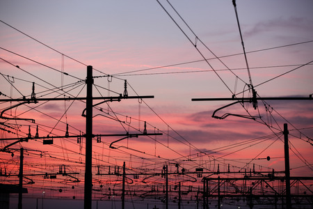 Impression network at transformer station in sunrise, high voltage up to full color sky take with sunset tone, horizontal frameの写真素材
