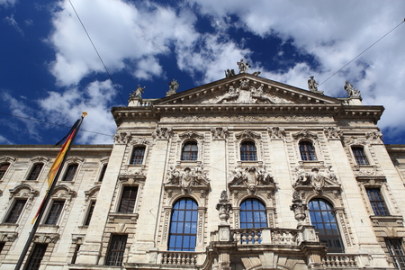 Medieval Town Hall building with spires Munich Germany. The first floor looks towards the Marienplatz- used for festivals and public events. The daily clock tower show is a tourist attraction.の写真素材