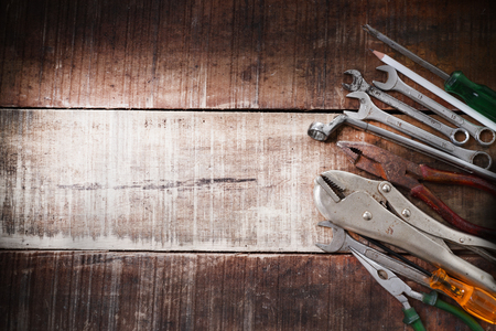 set of hand tools on a wooden panelの写真素材
