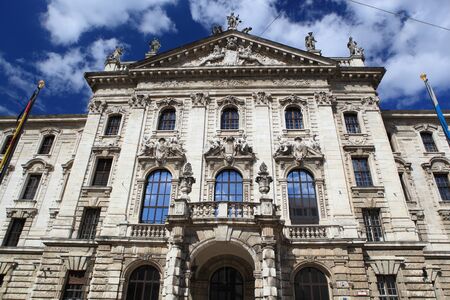 Medieval Town Hall building with spires Munich Germany. The first floor looks towards the Marienplatz- used for festivals and public events. The daily clock tower show is a tourist attraction.の写真素材