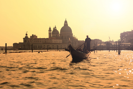 panoramic view of famous canal grande from famous rialto bridge at sunset in venice, italy with retro vintage style filter effectの写真素材