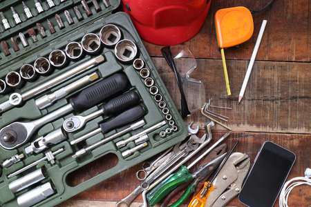 set of hand tools on a wooden tableの写真素材