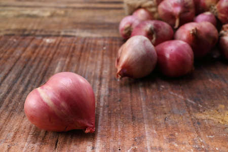 Shallot onions a group on wood , vintage styleの写真素材