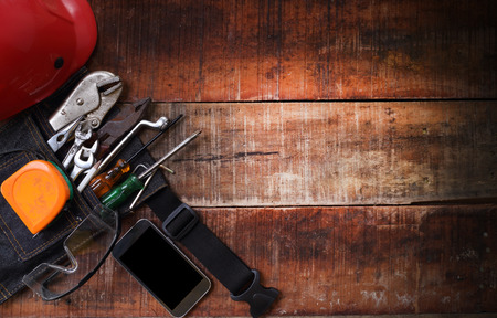 set of hand tools on a wooden tableの写真素材